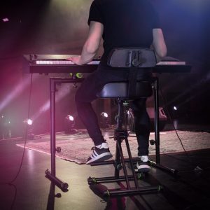 Height adjustable stool with foot and backrest